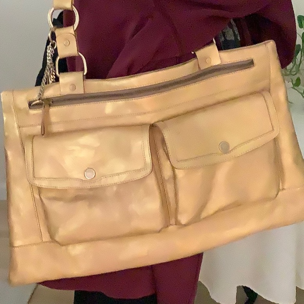 Dolce & Gabbana gold shoulder bag with two front pockets, never used.